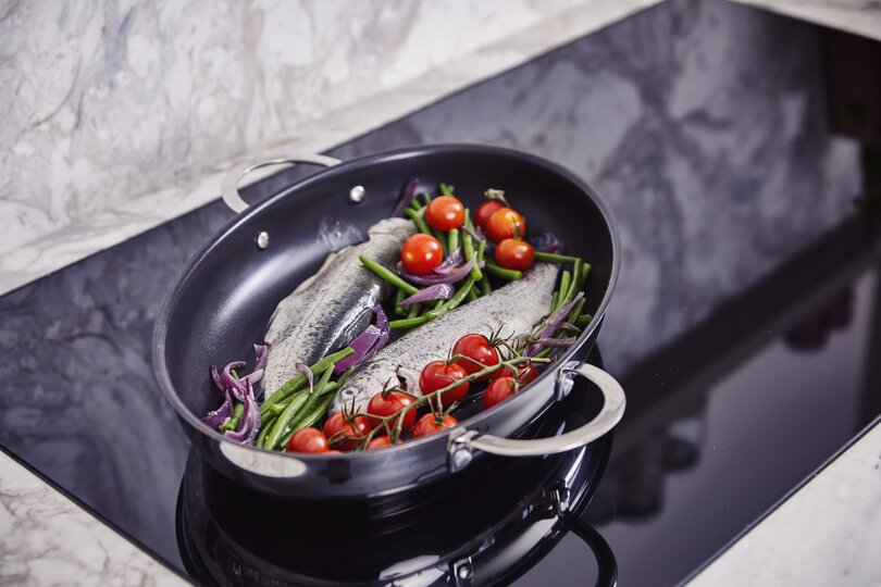 Poêle à poisson revêtue